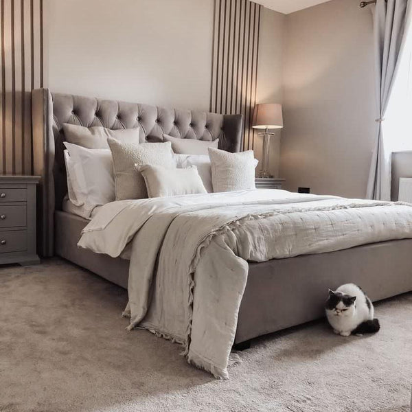 A bedroom decorated with Savannah Sleep, a pale warm grey paint from Zhoosh Paints.