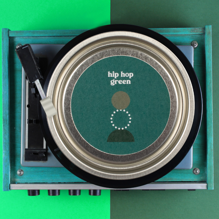 A tin of Hip Hop green on a record player