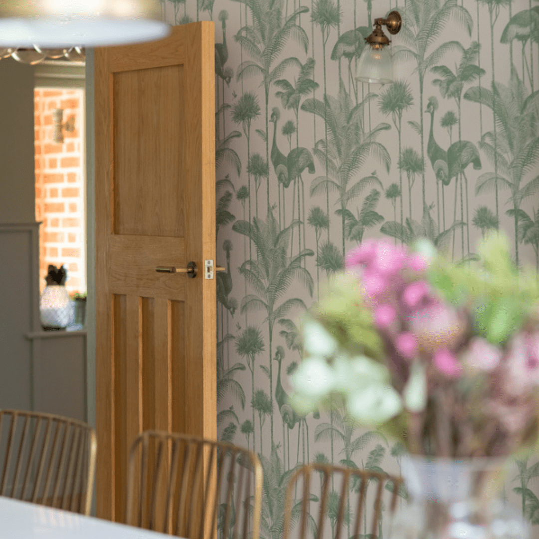A freshly decorated wall with flowers in the foreground