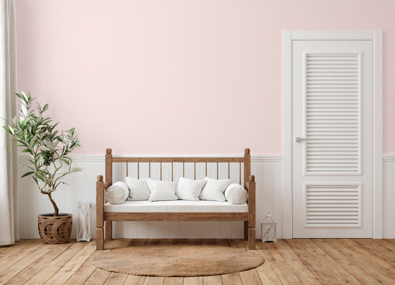 Bright and airy living room decorated in Cherry Blossom, a light pink wall paint from Zhoosh.