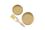 Tins of Rhythmic Yellow paint with a paint brush