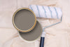 Tins of Hip Hop Grey paint with a paint roller