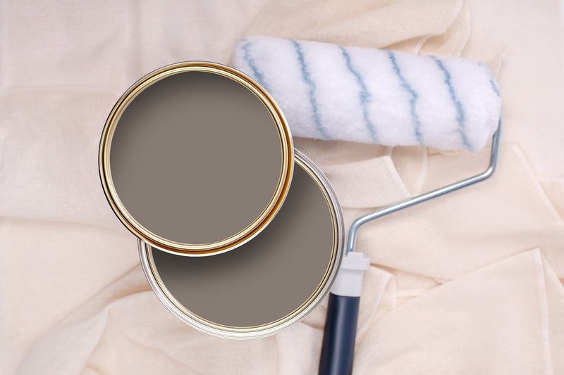 Tins of Hip Hop Grey paint with a paint roller