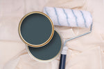 Tins of Pop Blue paint with a paint roller