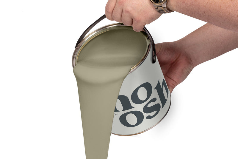 A person pours Country Green paint from a tin
