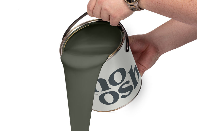 A person pours Pop Green paint from a tin