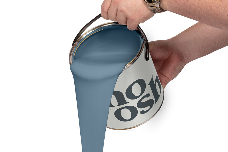 A person pours Reggae Blue paint from a tin
