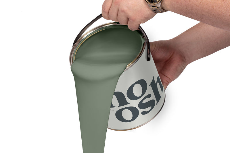 A person pours Reggae Green paint from a tin