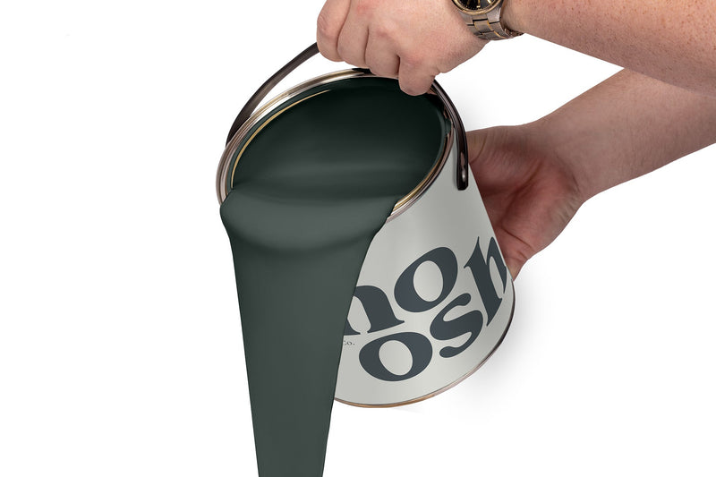 A person pours Rock Green paint from a tin